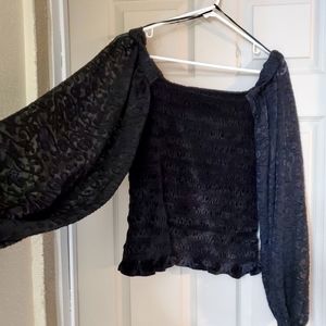 NWT Calligraphic black top Medium fitted and stretch with big sleeves